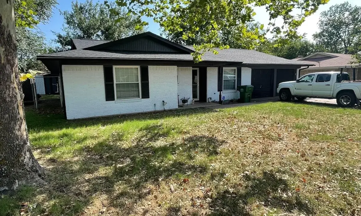 Professional roofing crew working on a residential roof in Pine Hills